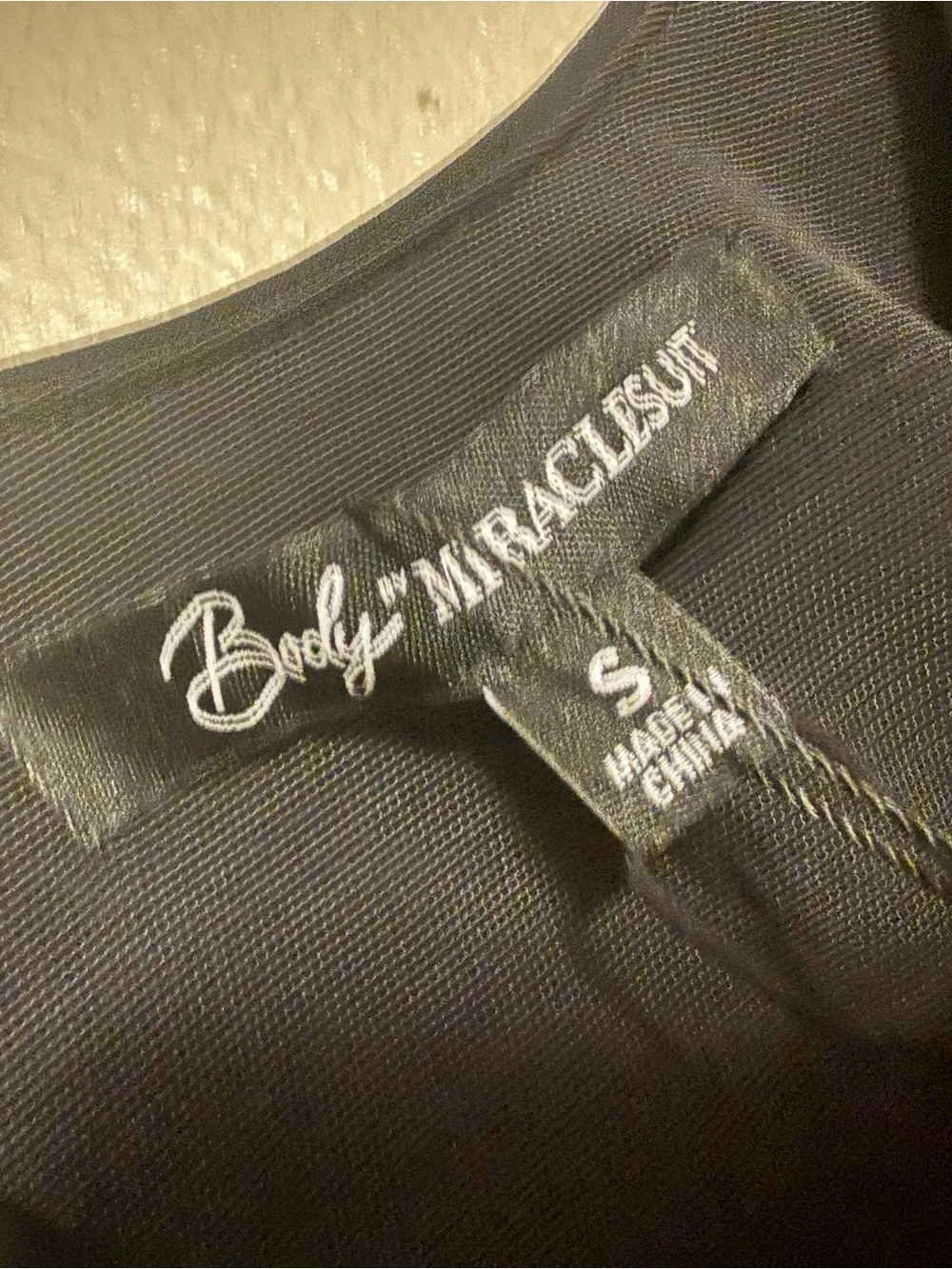 Miraclesuit tali shaping dress size small in black nwt